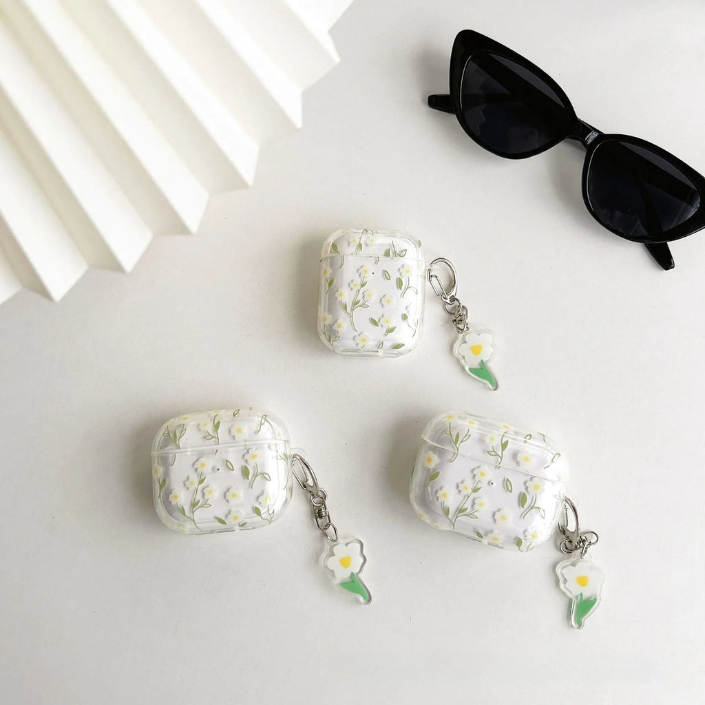 White floral pattern clear TPU protective case for Apple AirPods on a charging case.