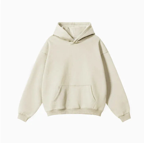 A loose-fitting men's cotton hooded sweater in a pullover style on a hanger.
