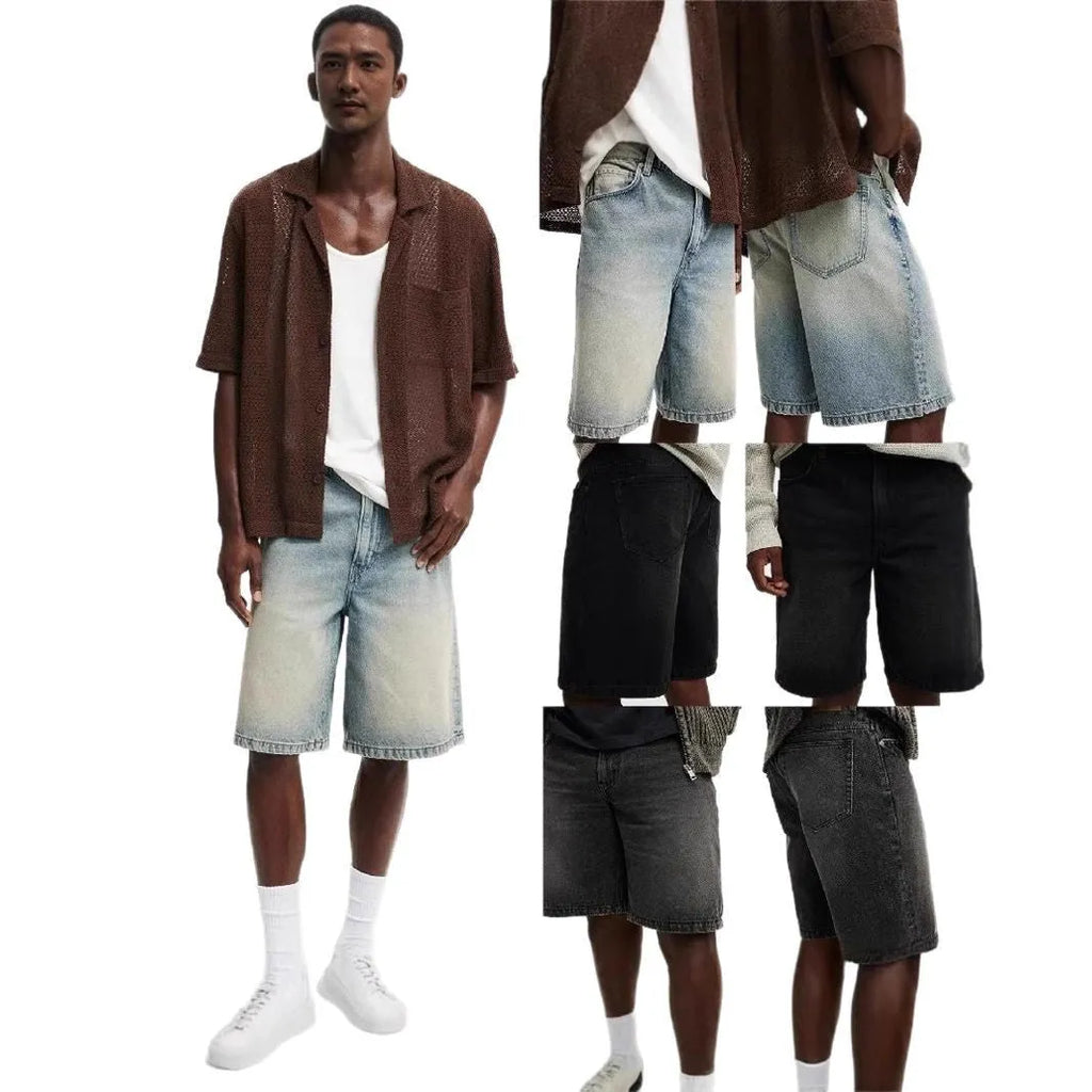 Man wearing loose fit light blue straight leg denim jeans on a street.