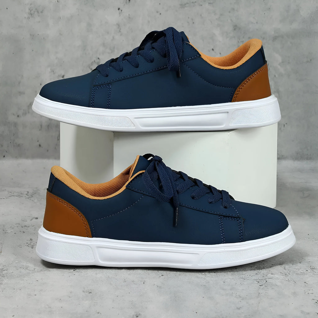 Platform skateboard casual sneaker in beige brown with low top, round toe, and a cross strap detail.