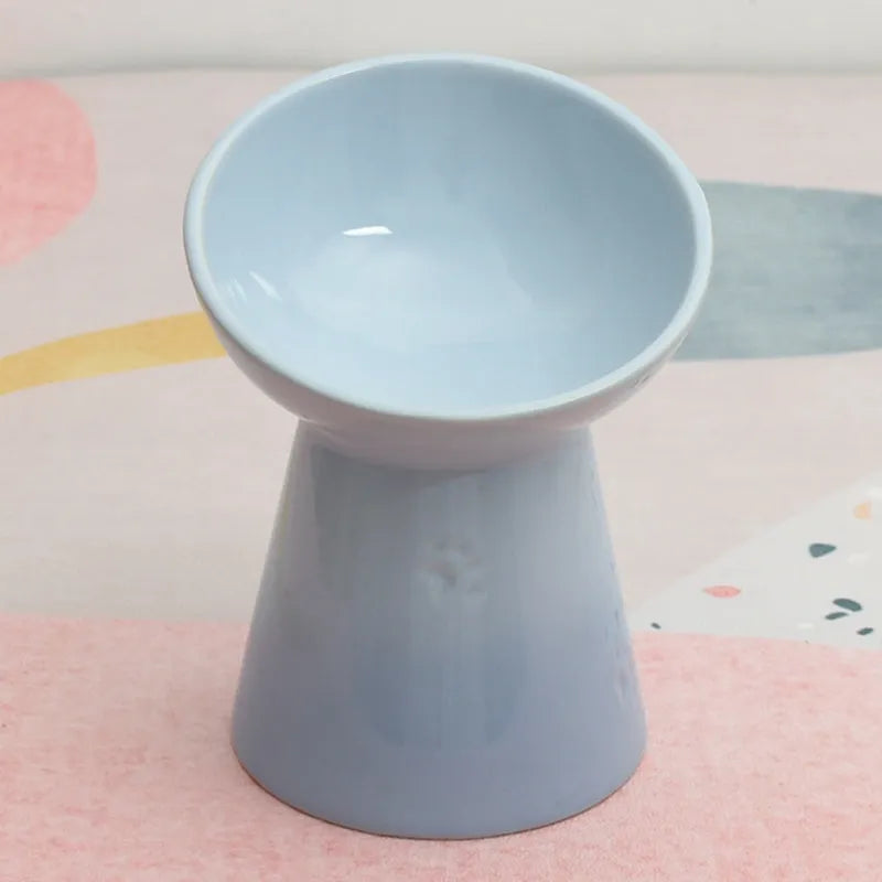 White ceramic pet bowl with a high foot neck and slanted rim for cat or dog feeding