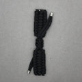 Paracord braided smartwatch strap in black on a watch, showing textured weave and connector lugs.