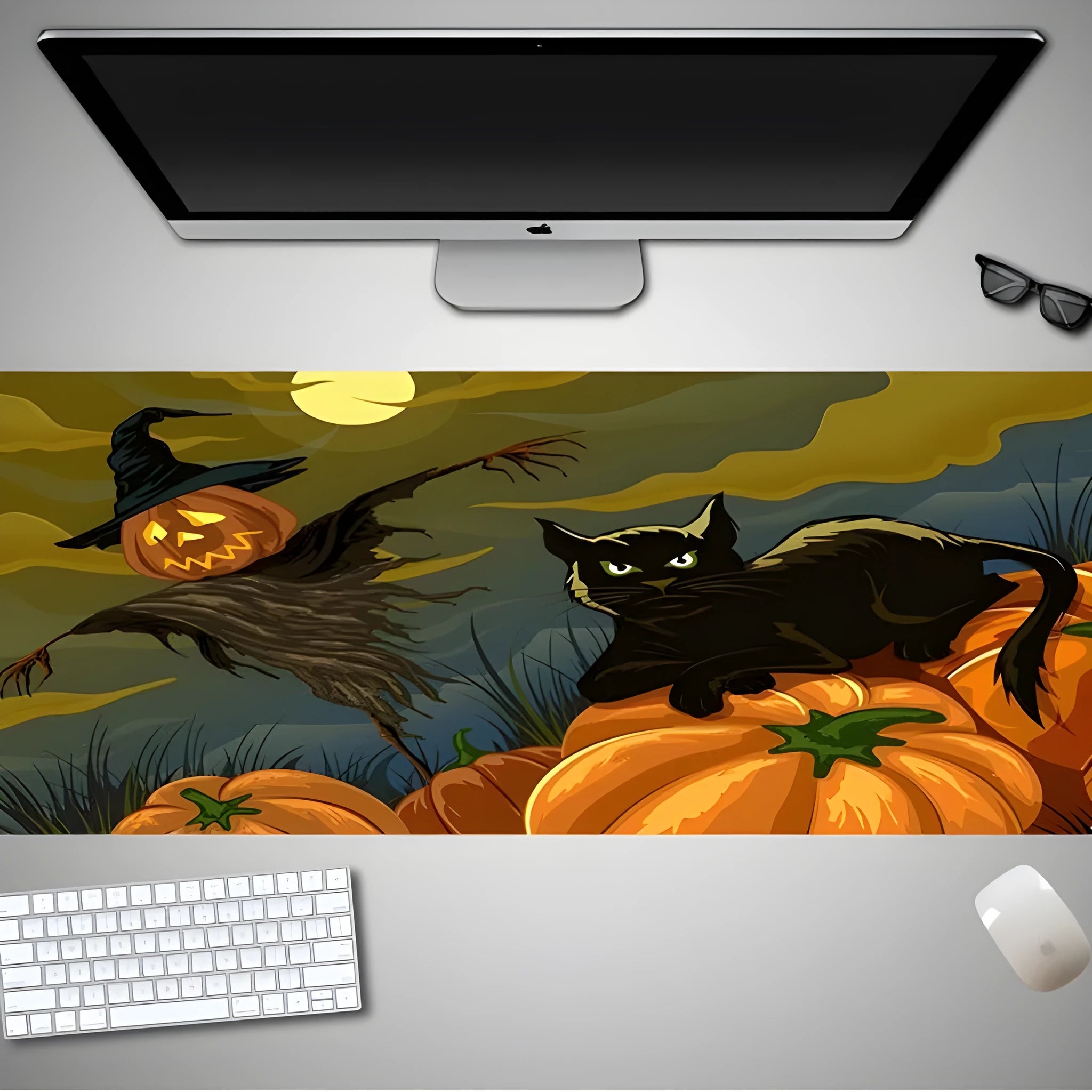 Large Halloween patterned gaming mouse pad on a desk showing non-slip rubber base and extra-long design.