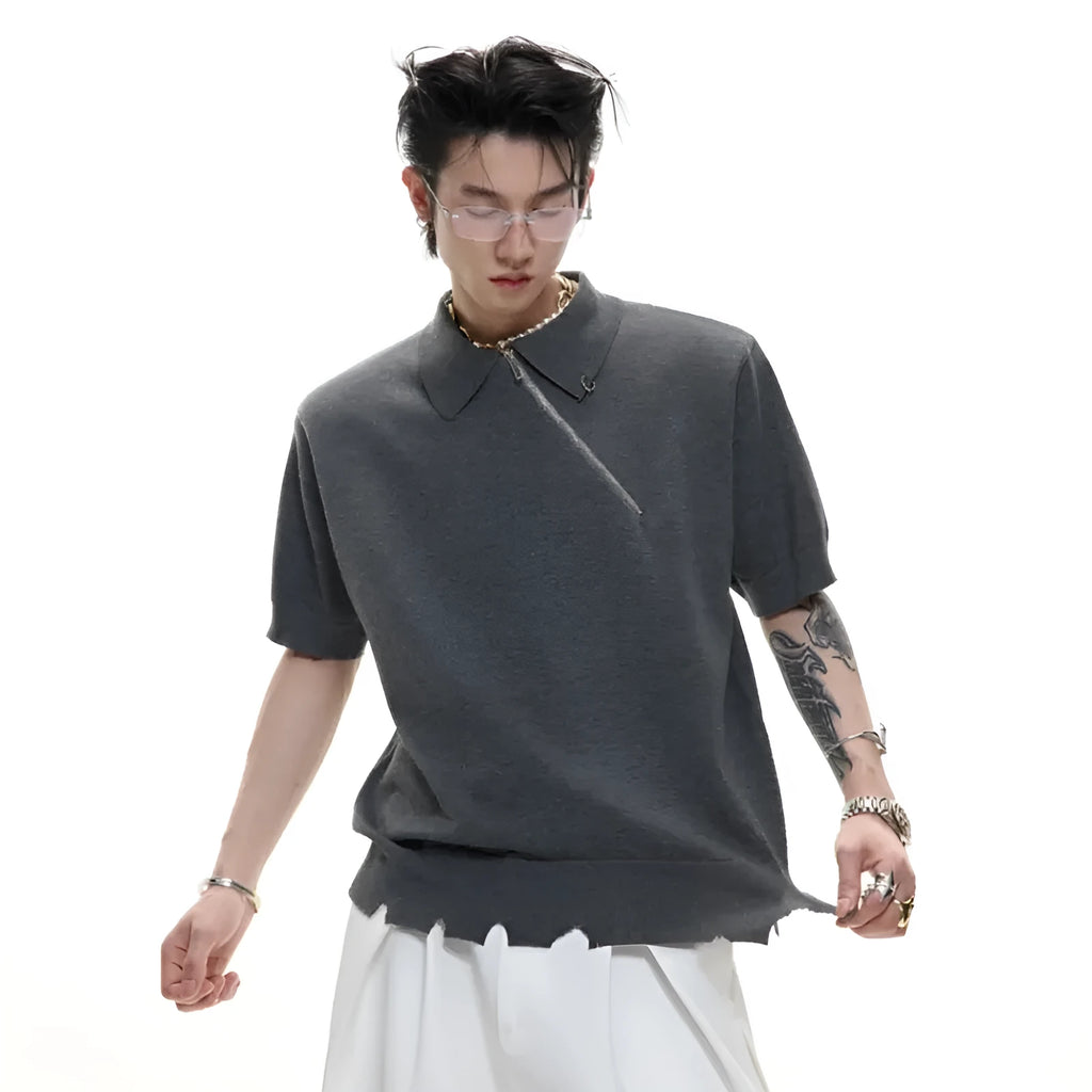 Man modelling a slim-fit black knitted polo shirt with an oblique zip closure and short sleeves.