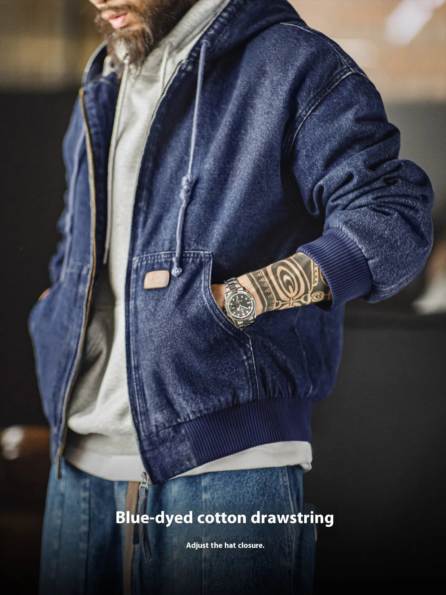 Blue tooling American retro washed denim jacket with hood and zipper front on hanger