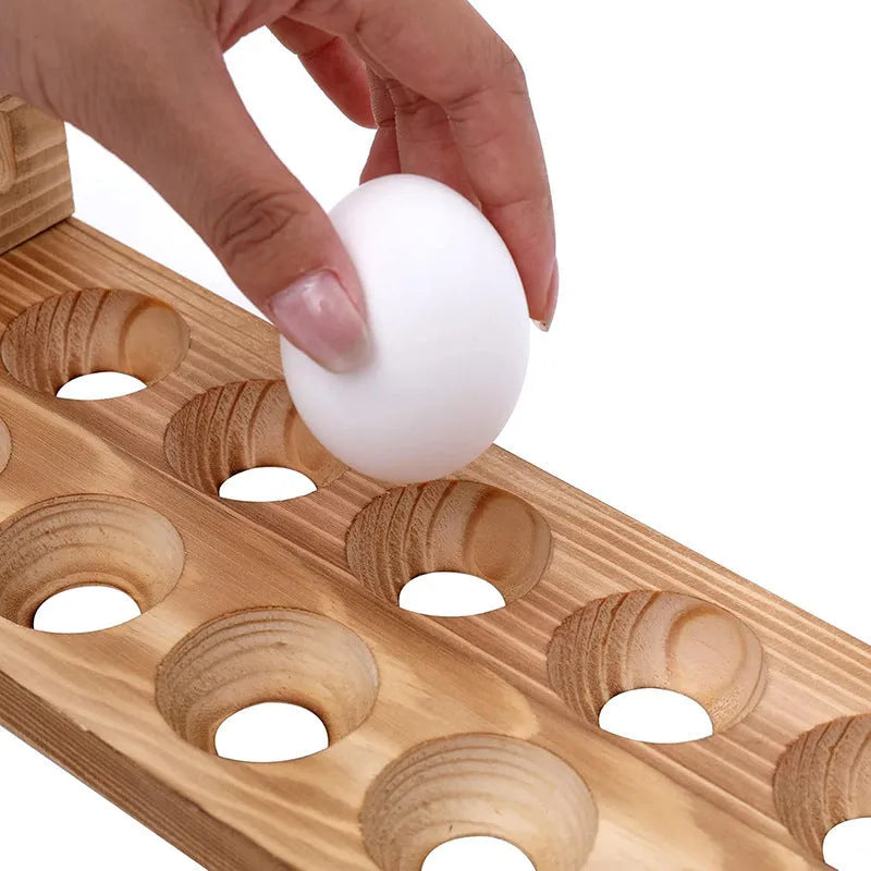 Solid wood egg storage rack in red Fire colour on a kitchen countertop