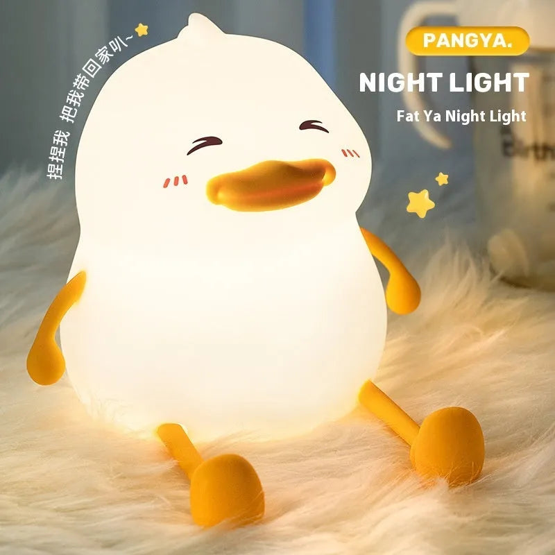 Chubby Night Light portable LED desk lamp on a wooden table showing soft glow and compact design