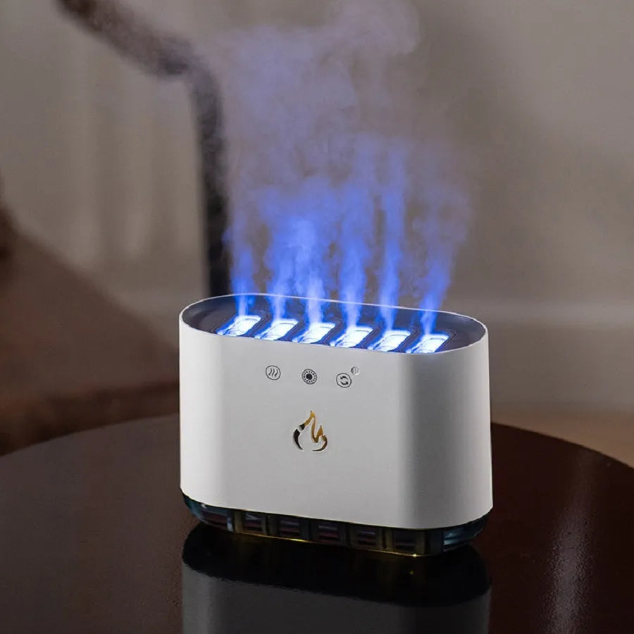 White cylindrical humidifier with colourful LED base and mist rising from the top.