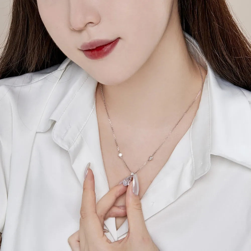 925 silver electroplated drop-shaped necklace in platinum white diamond finish on display