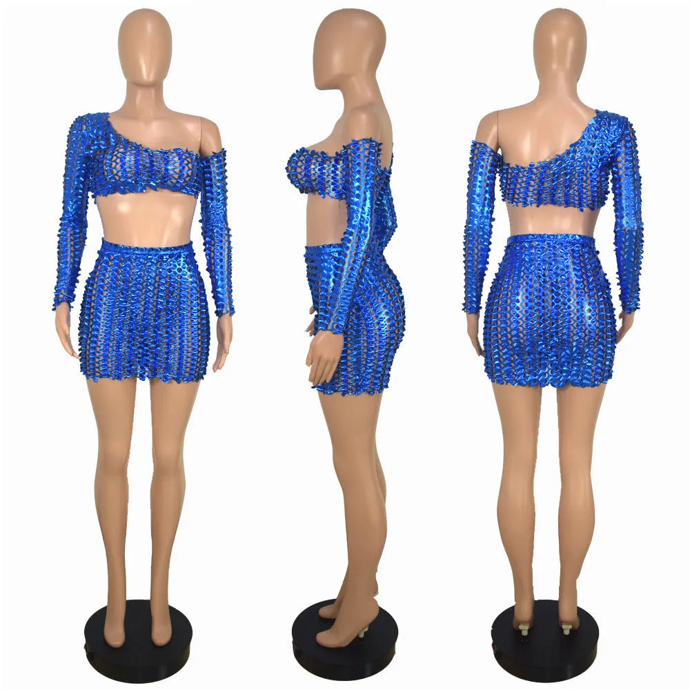 Women's black hollow-out net two-piece dress set with sleeveless top and short skirt.