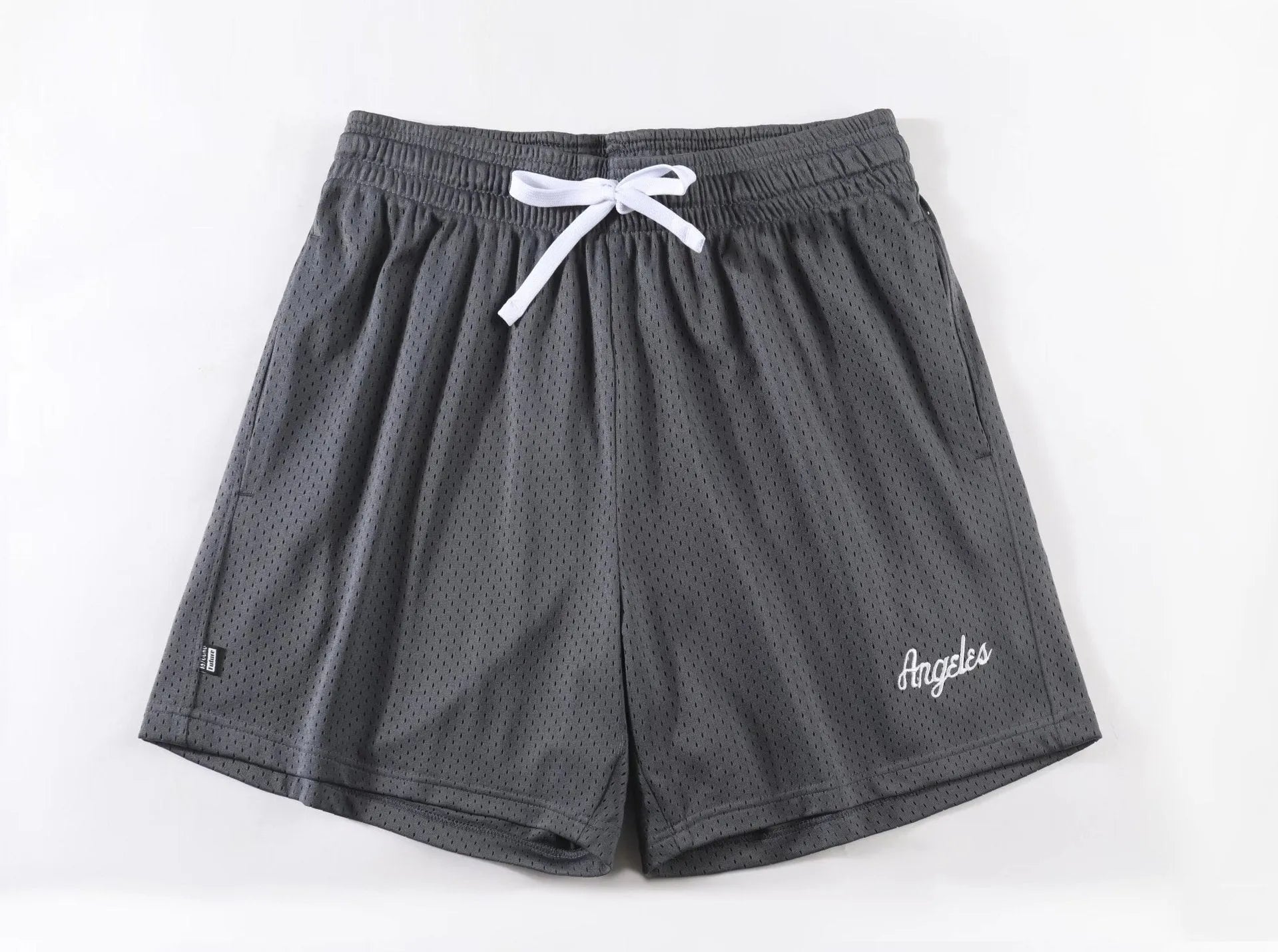 Men's black double-layer mesh sport shorts made from polyester fabric.