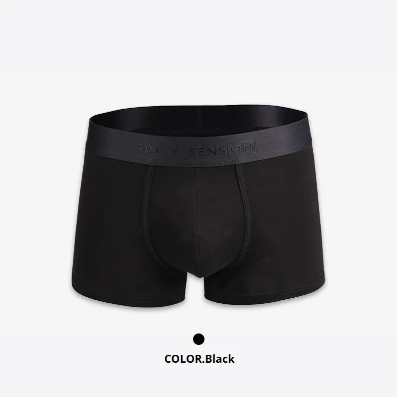 Men's solid colour cotton boxer shorts in black, shown in a loose fit style.