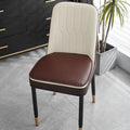 Leather horseshoe-shaped seat cushion in beige colour showing thickness and shape