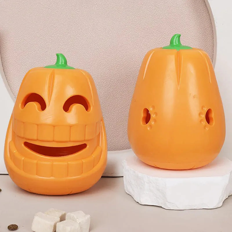 Orange Halloween pumpkin shaped dog chew toy with treat dispensing openings
