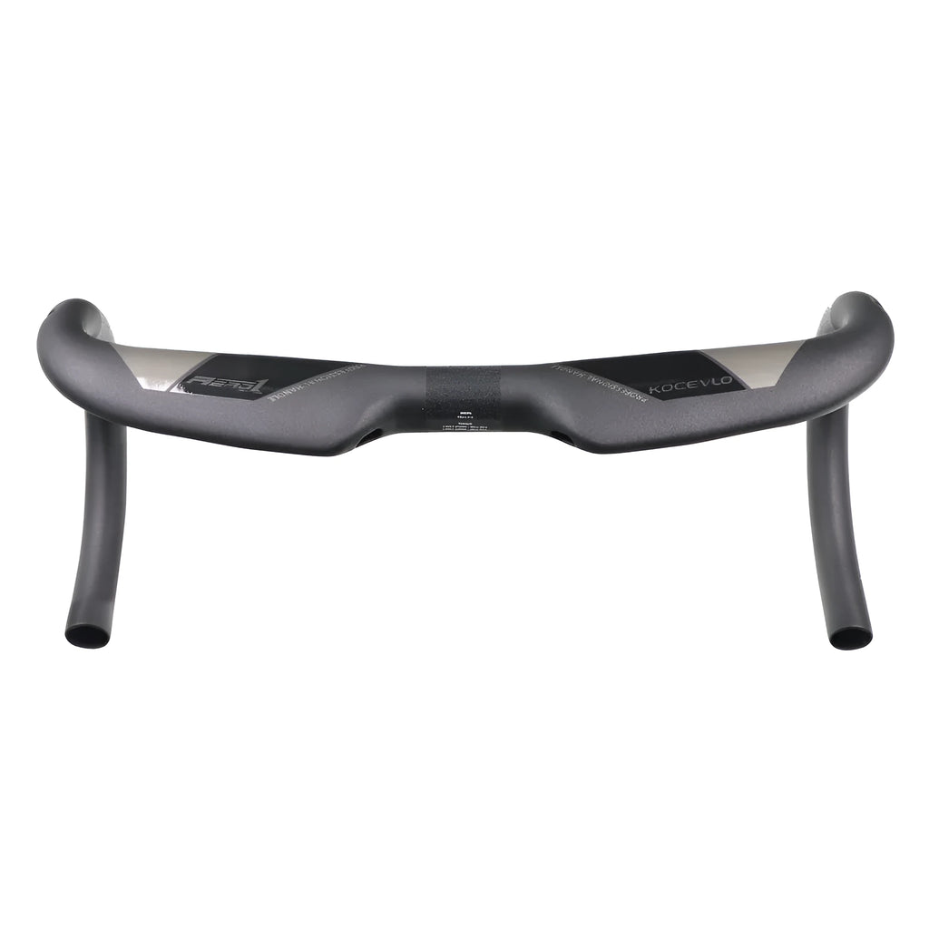 Matt black carbon fibre road bike handlebar with shallow drop, shown from a top-down angle.