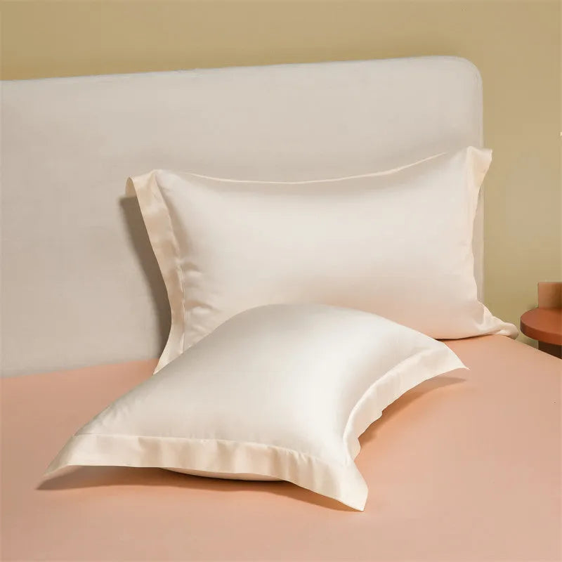 Luxury Lenzing Tencel bedding set in Aurora Blue on a bed, showing quilt cover, sheet, and two pillowcases.