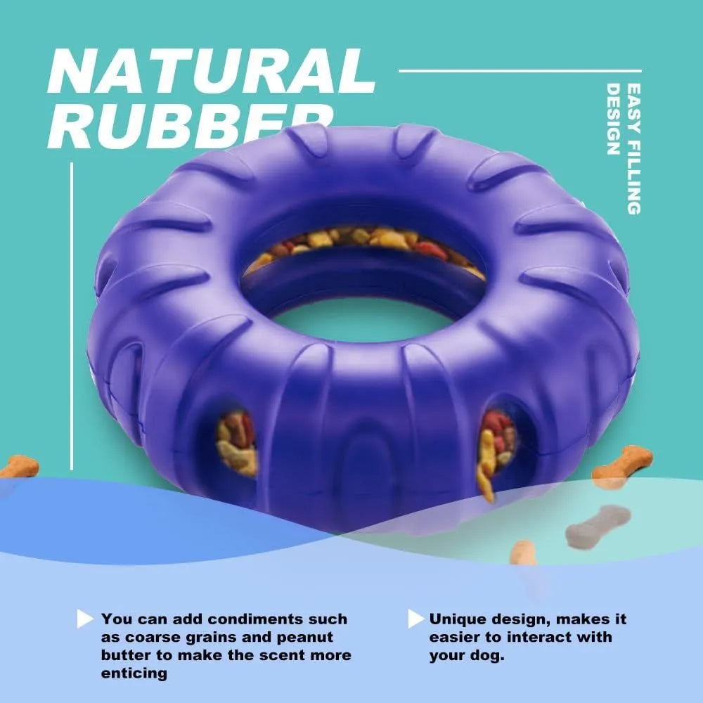 Blue natural rubber tyre-shaped dog chew toy with oval openings, for slow feeding and interactive play.