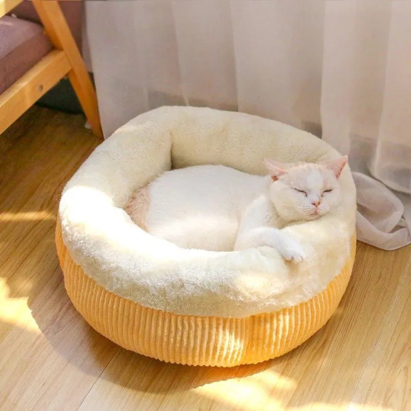 Washable circular cat sofa bed in yellow with plush fabric and non-slip base for calming sleep