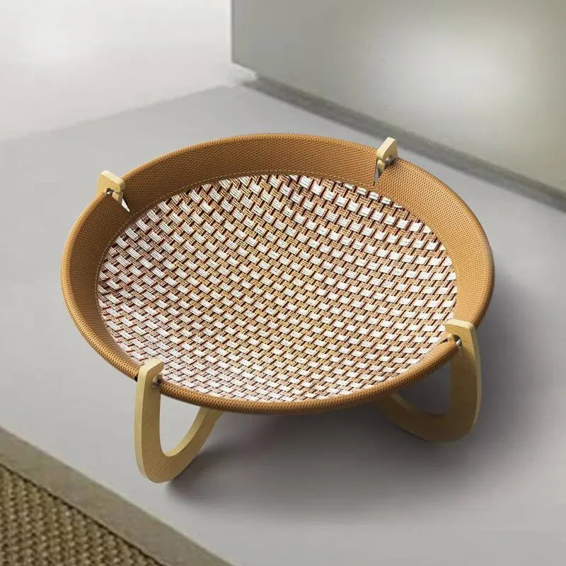 Brown woven rattan pet hammock bed raised off the ground