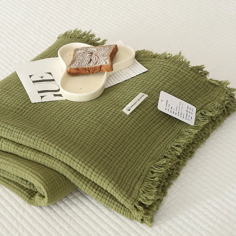 Four-layer cotton gauze blanket with tassel trim in navy blue colour