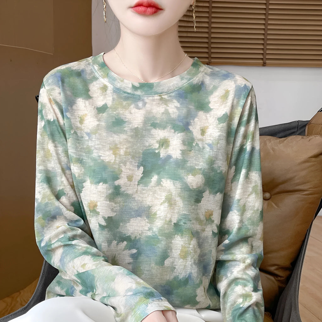 A women's round neck pullover in a Tencel cotton knitted fabric, shown in a printed colourway with regular sleeves.