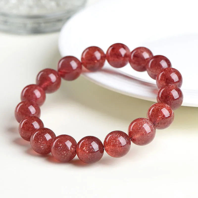Natural cherry red strawberry quartz bracelet with geometric beads showing starlight effect