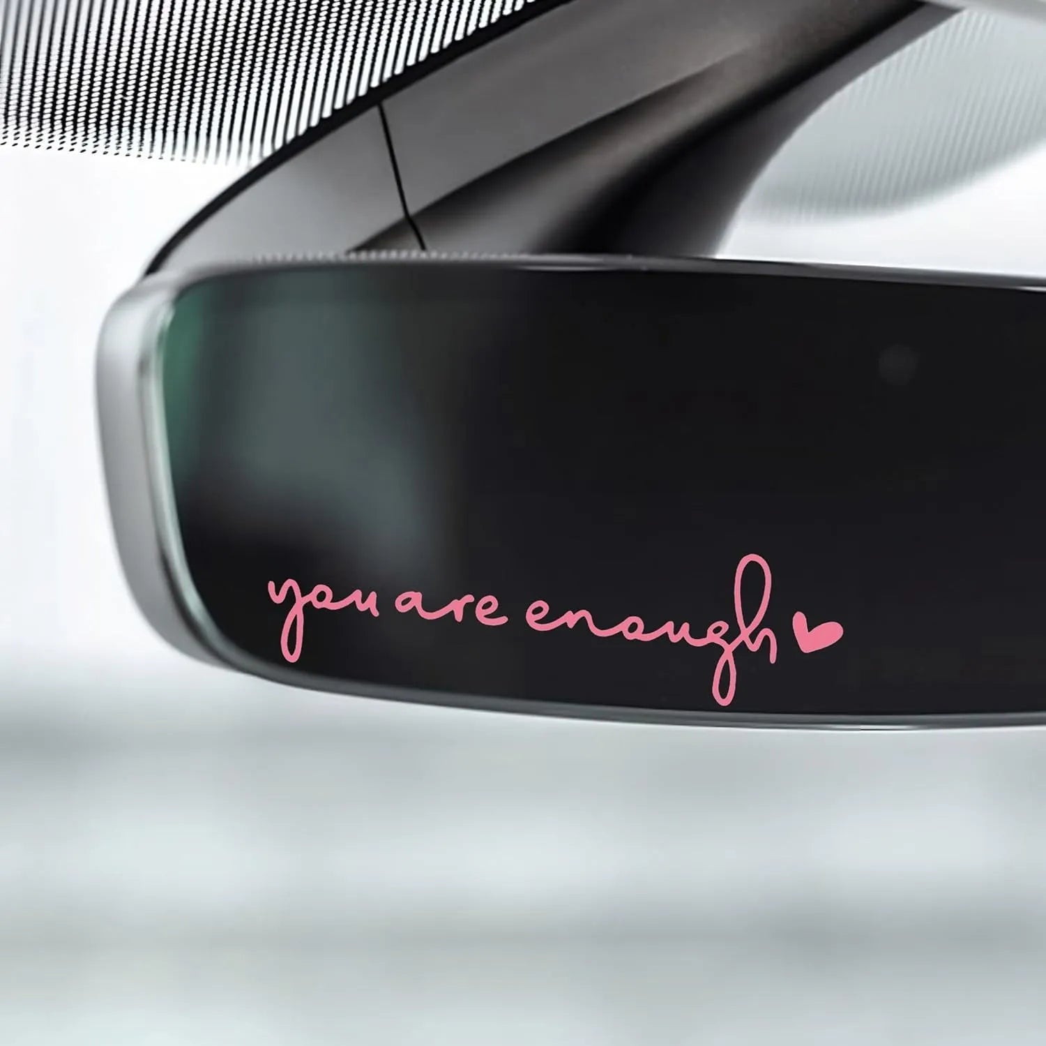 Plastic rearview mirror sticker 10x3cm in black on a car mirror