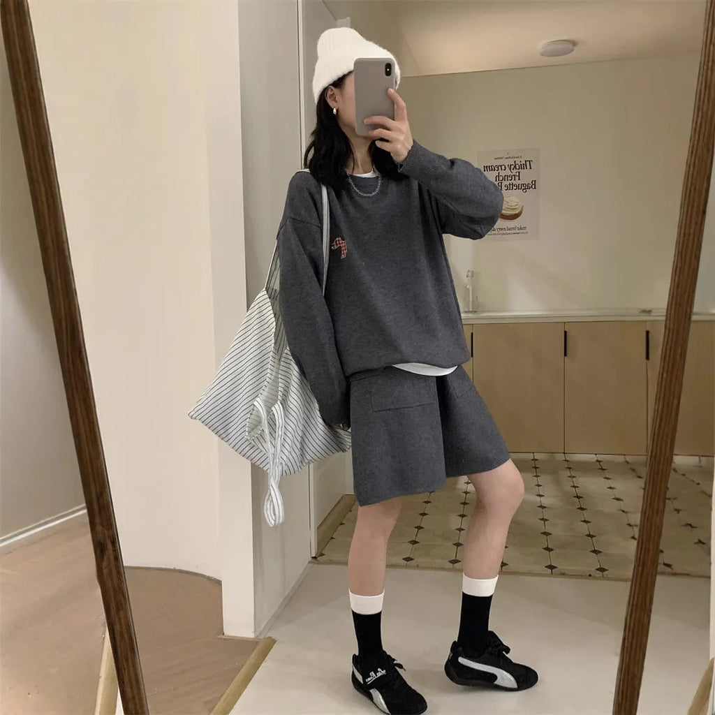 Women's milk blue knitted sweater and shorts suit with embroidered animal pattern.