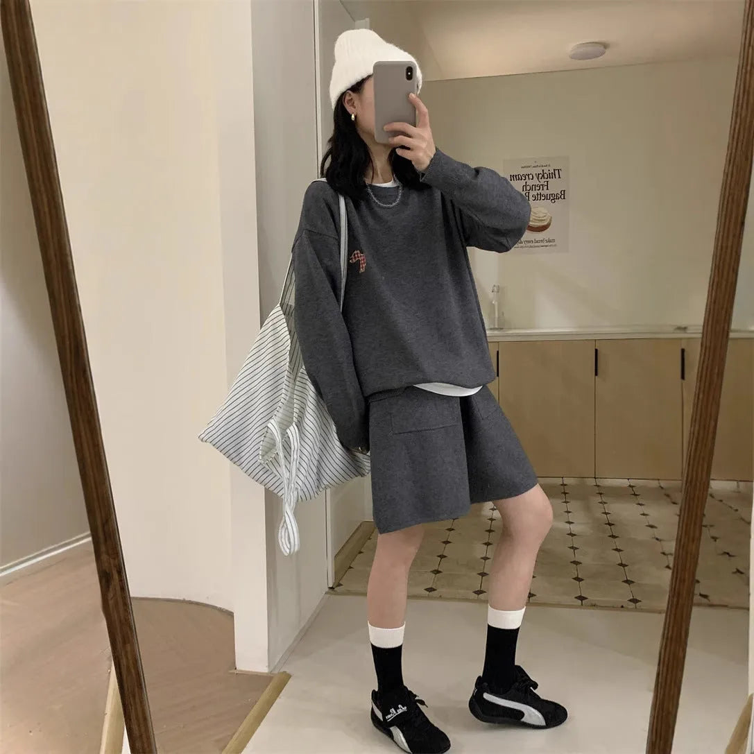 Women's milk blue knitted sweater and shorts suit with embroidered animal pattern.