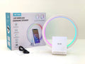 White smart Bluetooth speaker with wireless charging surface and ambient lighting