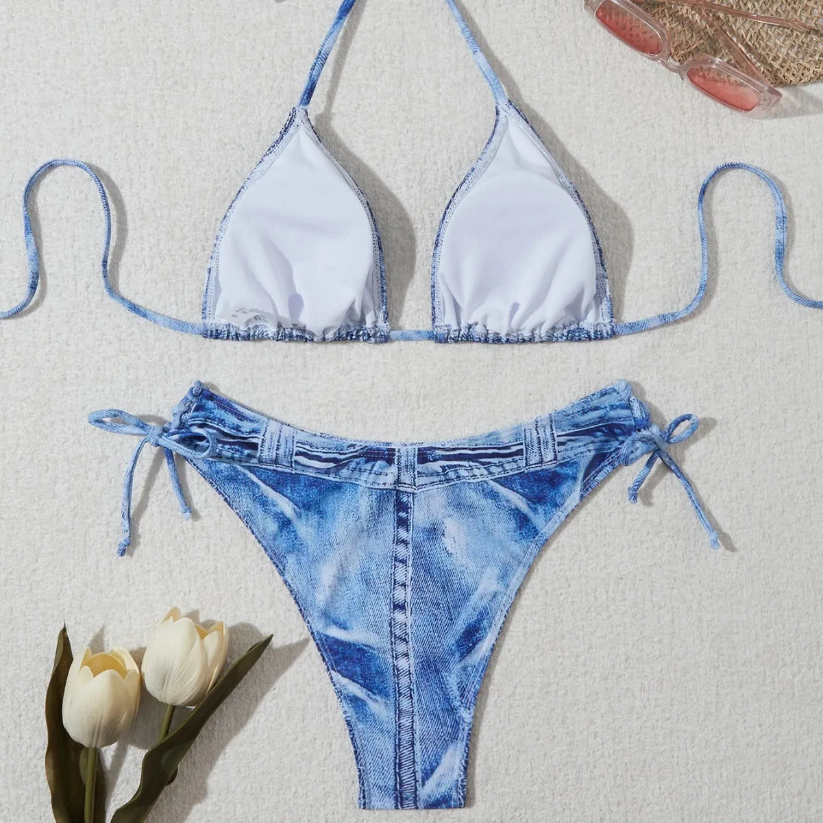 Women's denim blue printed bikini set with strap detail, made from nylon spandex fabric.