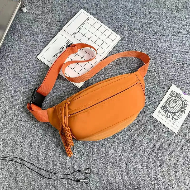 Men's adjustable crossbody bag in black showing compact dimensions and sport design