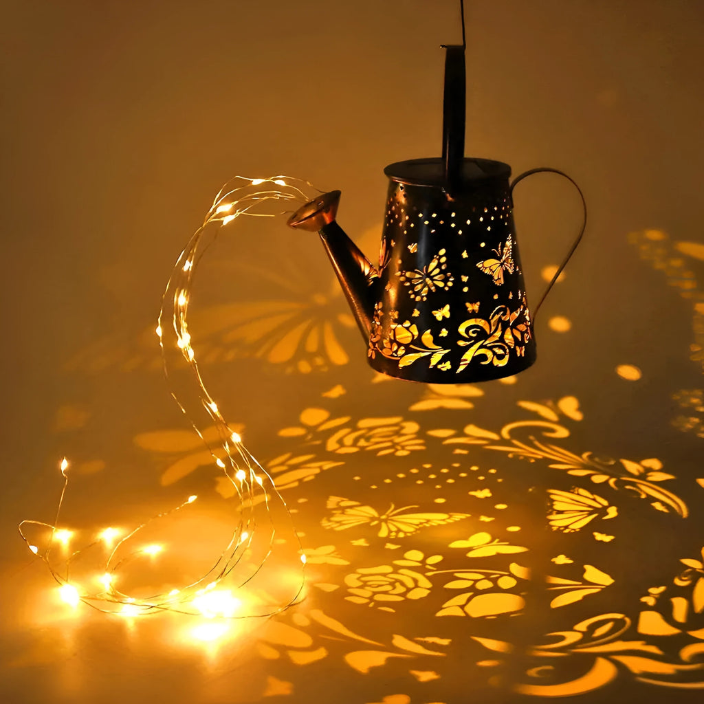 Iron solar garden lamp with tapered butterfly pattern and warm white LED light.
