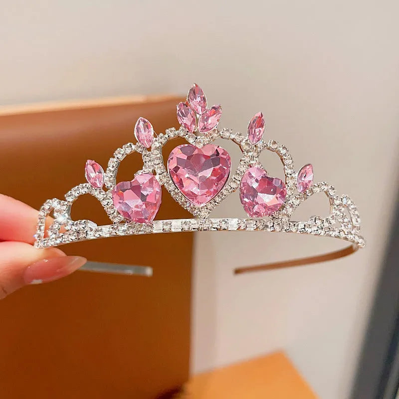 Girl's shiny metal headband with a crystal crown design in pink, light blue, and light purple colours.