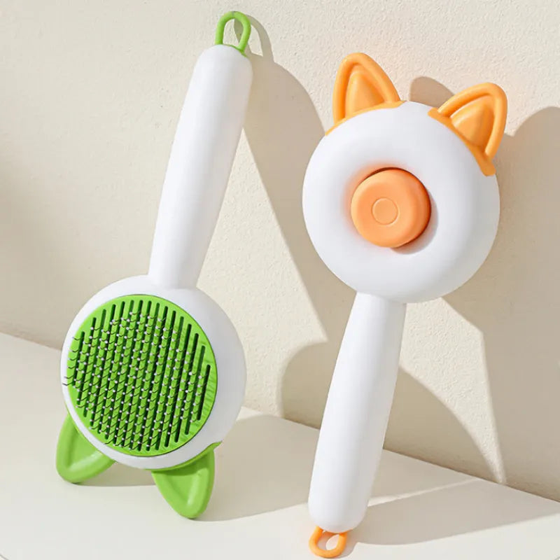 Self-cleaning cat grooming brush with stainless steel tines in greenish white colour