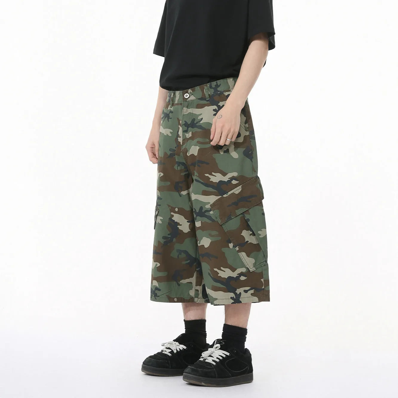 Men's camouflage print cotton jeans with a wide leg, cropped length, and large front pockets.