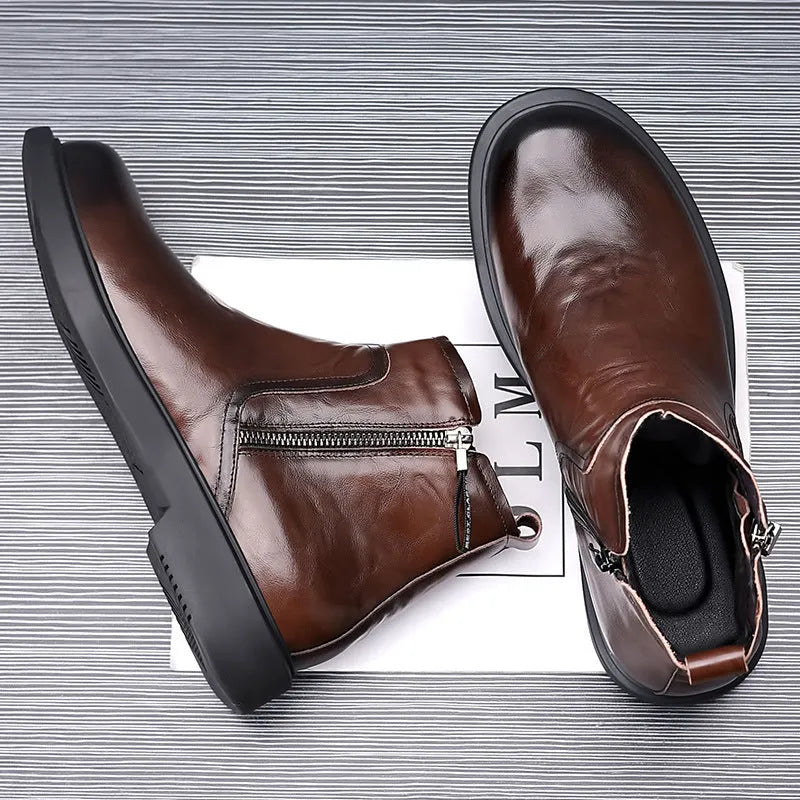 Men's brown and black genuine leather Chelsea boots with side zipper, mesh lining, low heel, and rubber sole.