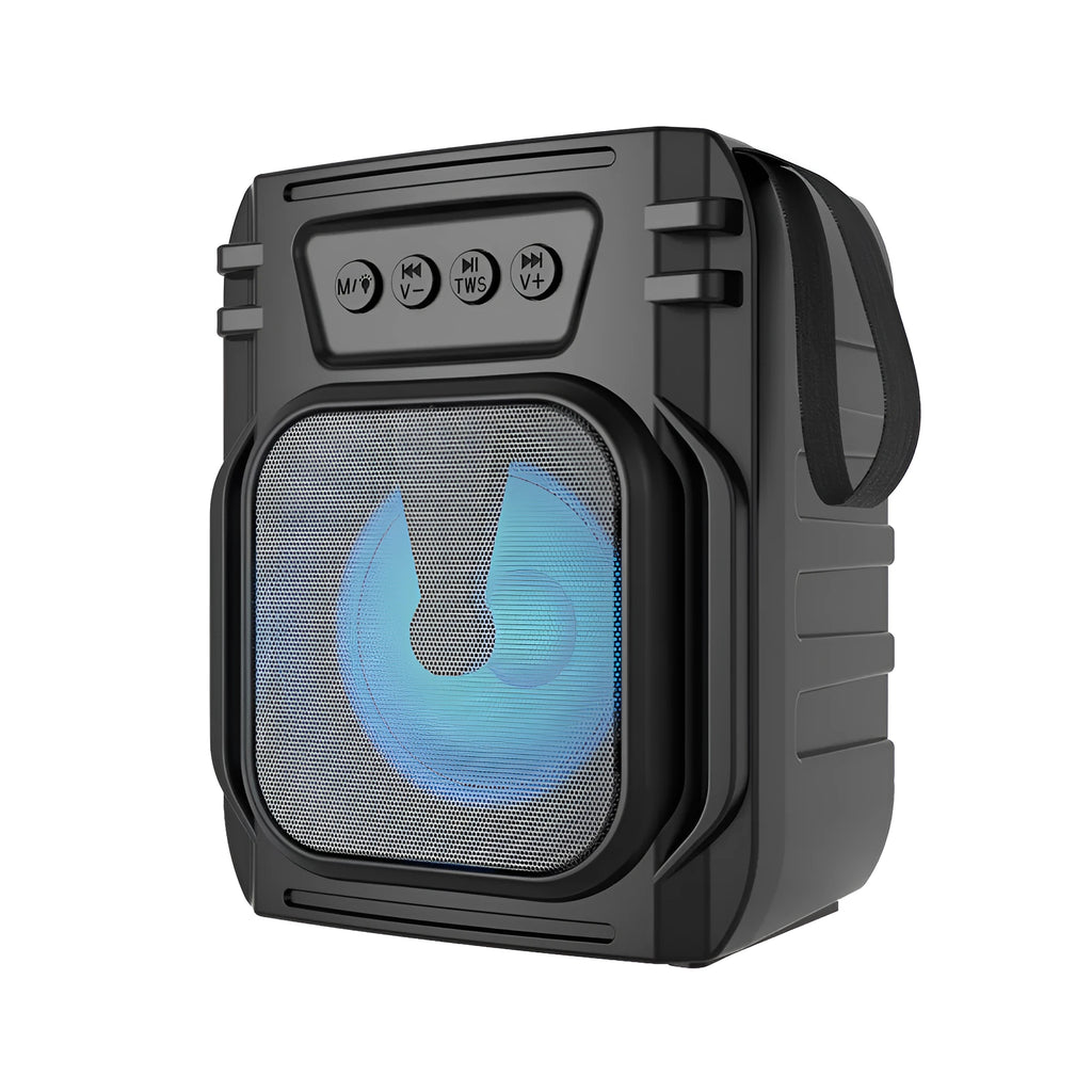 Compact rectangular portable Bluetooth speaker with USB charging cable on a desk.