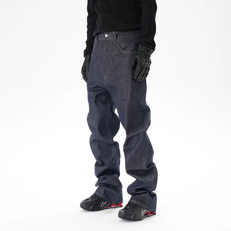 Man wearing dark blue loose fit straight leg denim jeans.