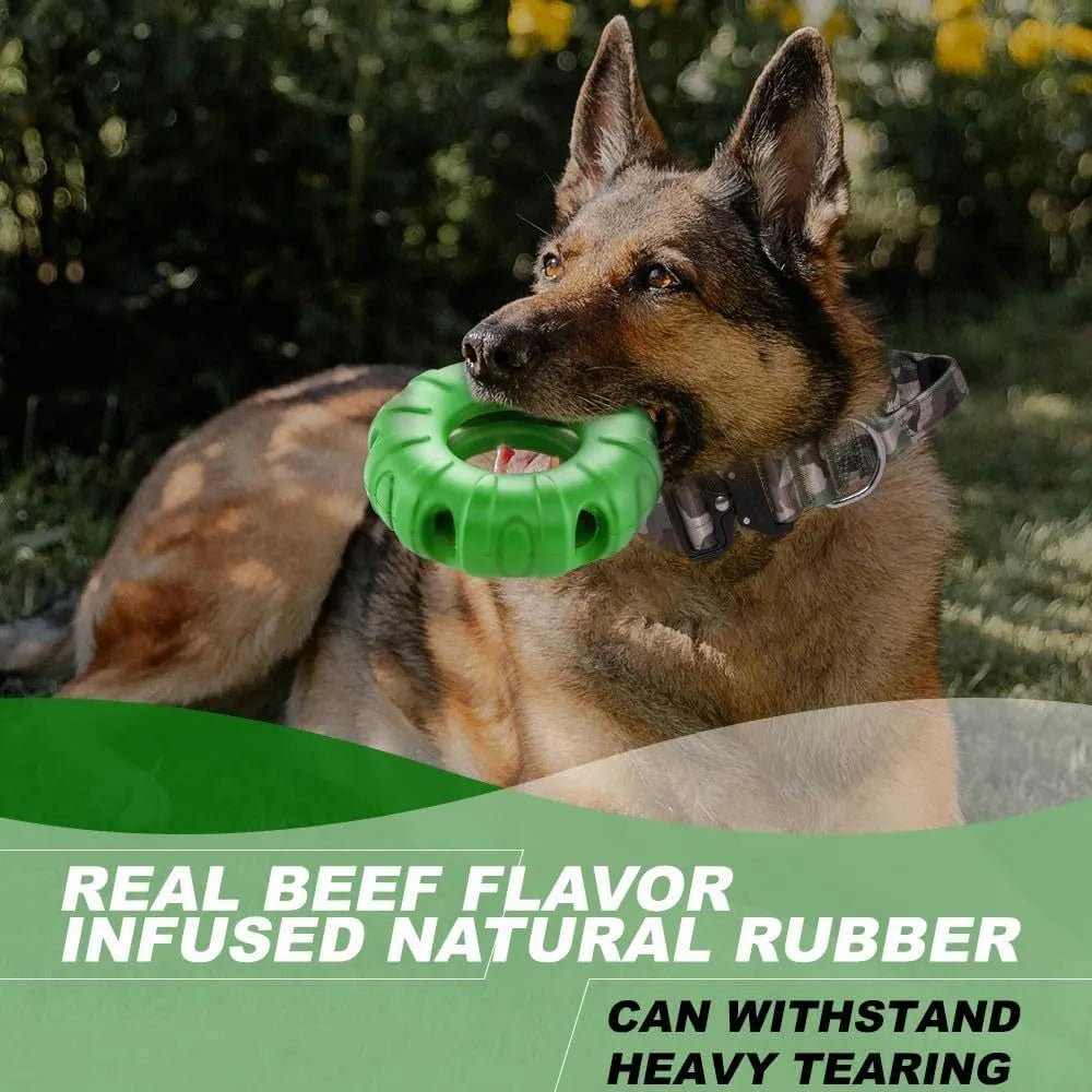 Blue natural rubber tyre-shaped dog chew toy with oval openings, for slow feeding and interactive play.