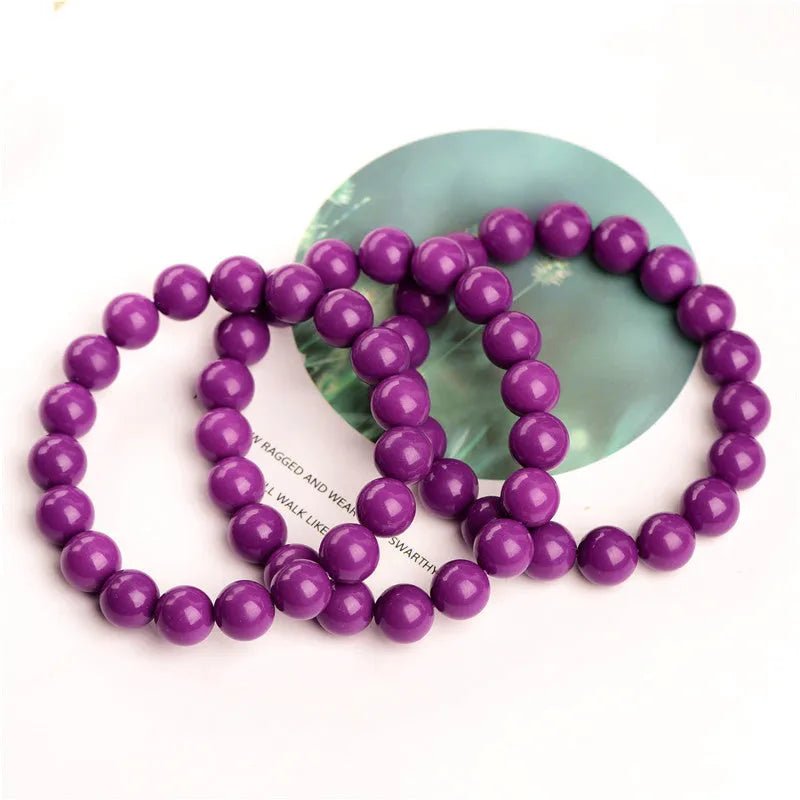 Jiuya purple mica crystal bracelet showing polished beads in a single circle design on a wrist.