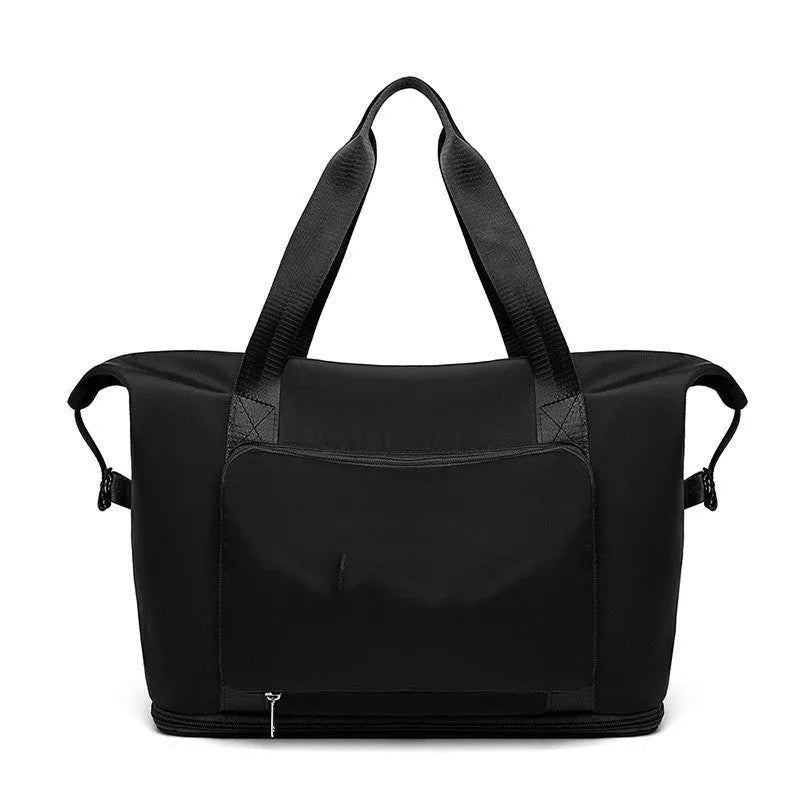 Foldable large capacity women gym bag in black with multiple pockets and shoulder strap