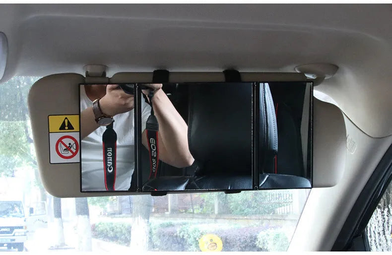 Silver folding car makeup mirror shown closed and opened, highlighting its compact and large glass sizes.