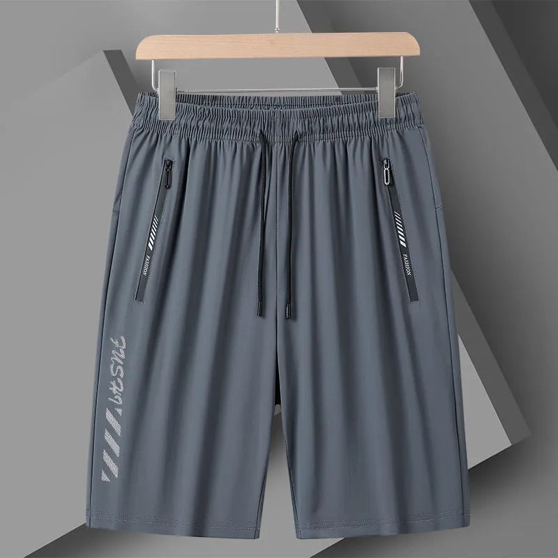 Men's black quick-dry loose-fit nylon sports shorts on a size chart background