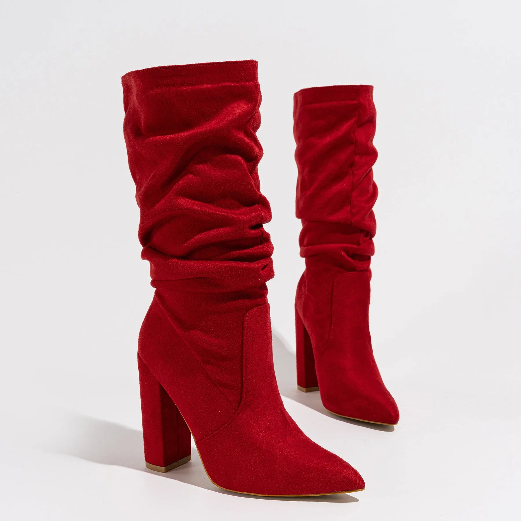 Black suede women's boots with a chunky high heel and pointed toe.