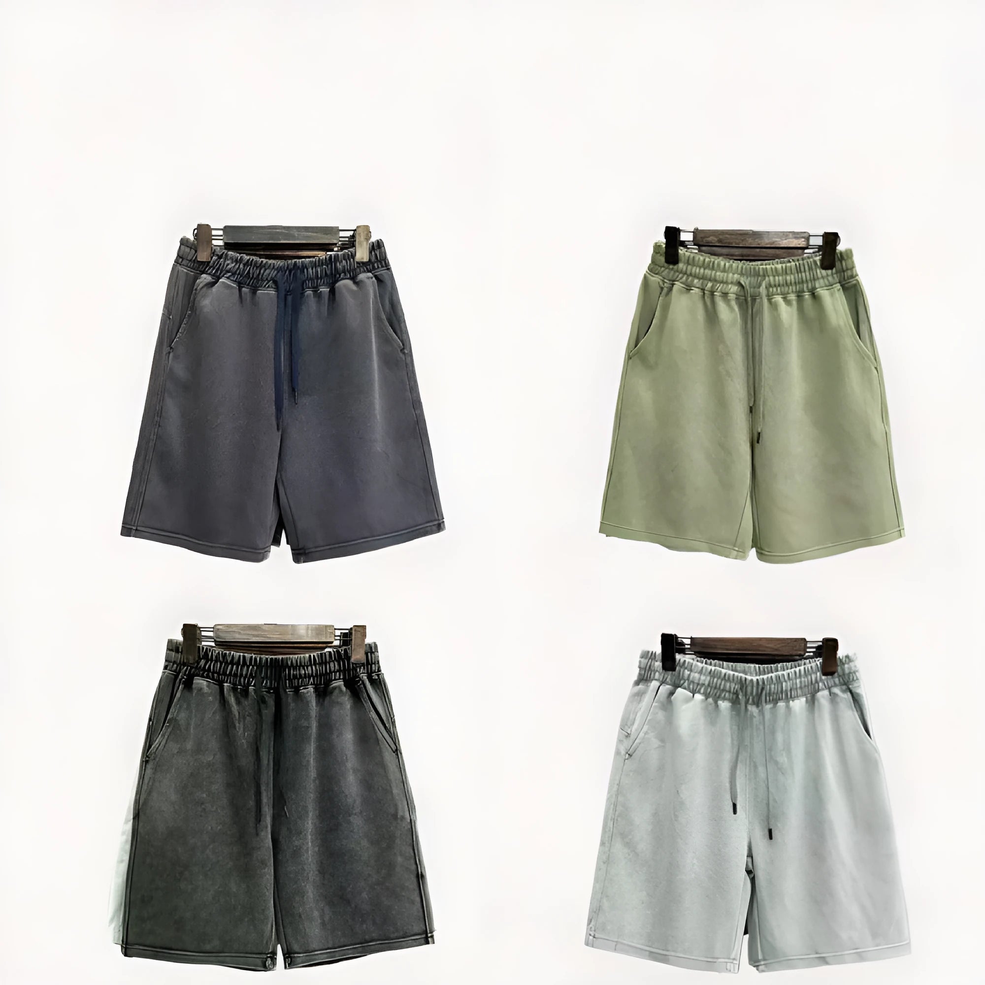 Man wearing loose-fit distressed cotton shorts in a solid colour.