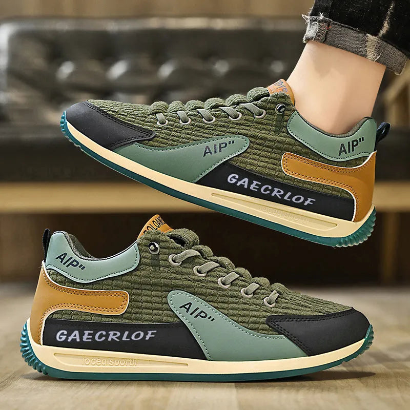 Men's green and grey low-top mesh running shoes with lace-up front and round toe.
