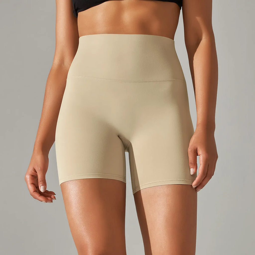 Women's high waist fitness pants in dark green with belly contracting design for athletic activities