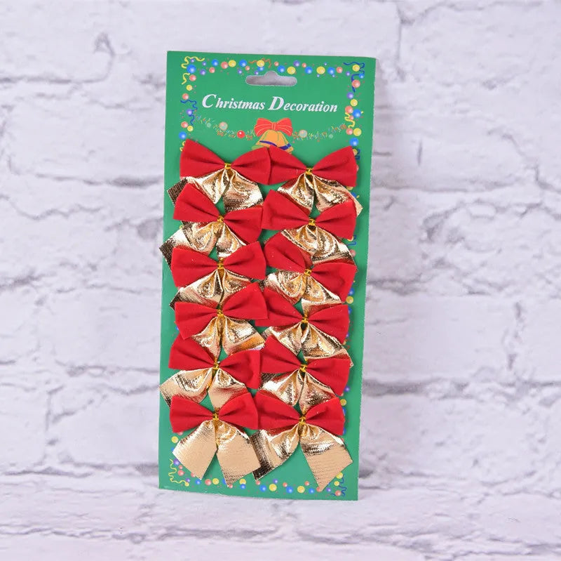 Red, gold, red gold, and silver 5 cm polyester Christmas bow ornaments on a green tree branch.