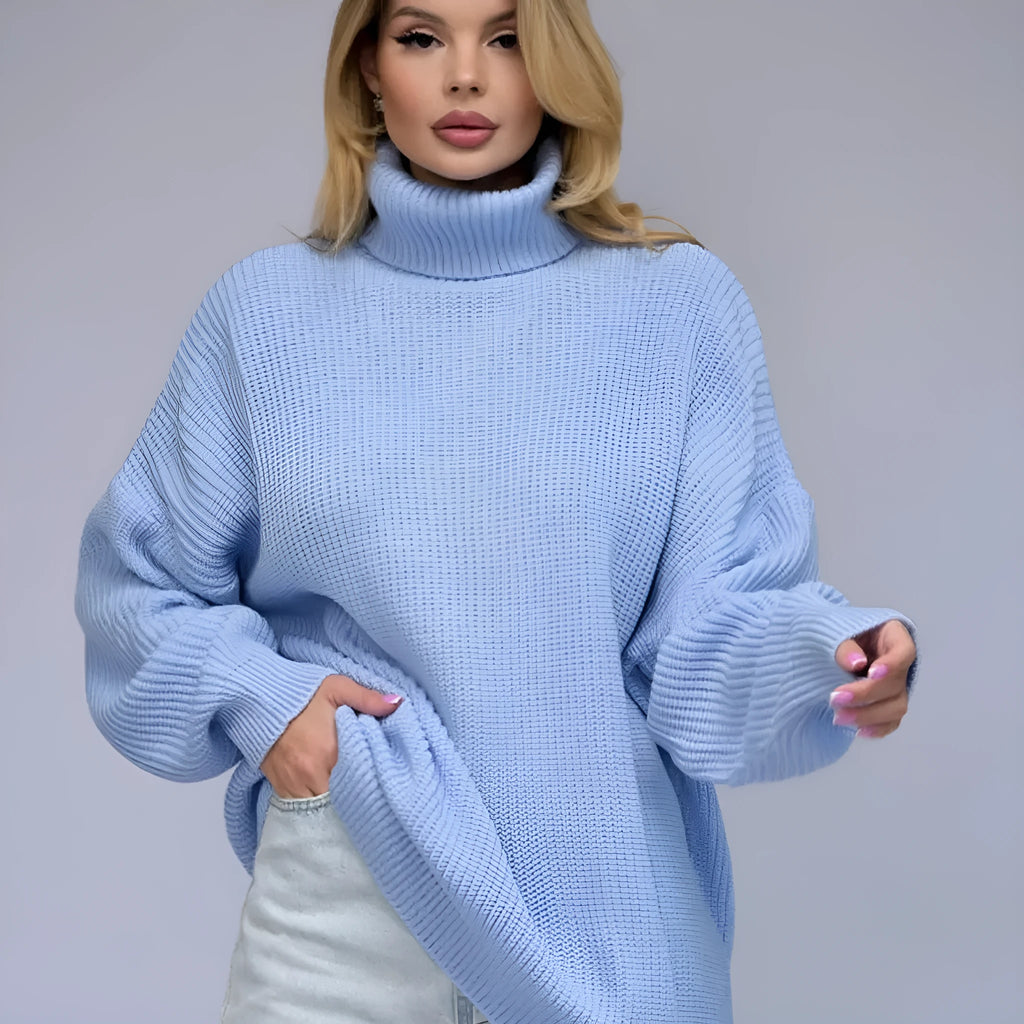 Women's solid colour high neck pullover sweater in a loose fit, shown in grey.